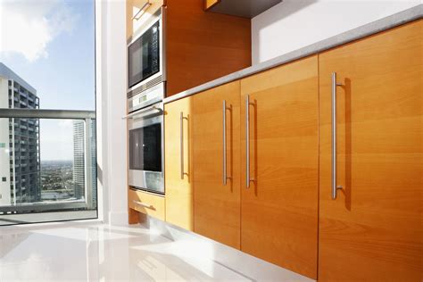 In case you're looking to remodel your kitchen into a contemporary one, consider having slab door cabinets. Slab Cabinet Doors: The Basics
