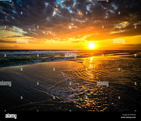 Sun Over Ocean With Ripples Stock Photo Alamy