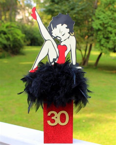 Red feathers sit on the the top of the base, finished with betty boop made from card. Betty Boop centerpiece birthday party decorations candy ...