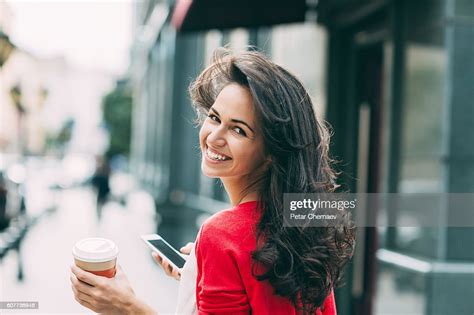 Beautiful Woman Looking Back Over Her Shoulder High Res Stock Photo