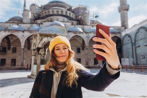 Premium Photo Young European Woman Takes A Selfie Portrait In