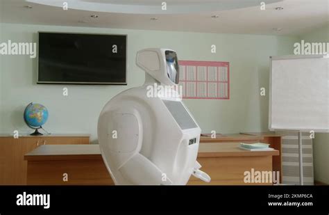 Robot Teacher Futuristic School With A Screen Torso Turning Around To