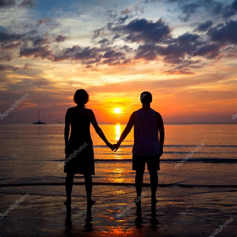 Silhouettes Young Couple On The Beach At Sunset Romantic Picture
