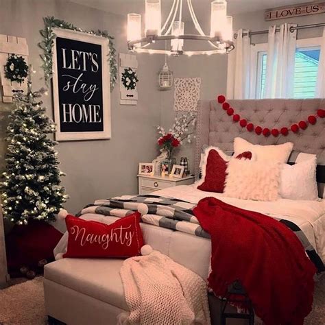 A Bedroom Decorated For Christmas With Red And White Decorations On The