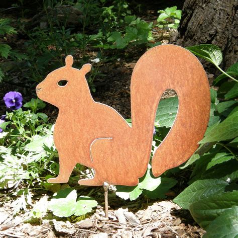 You've got lots of free craft materials in your recycle bin. Rusty Finish Metal Garden Art Squirrel Yard Stake