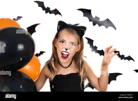 Smiley Girl With Black Cat Costume Halloween Makeup And Black And Orange Balloons At Halloween