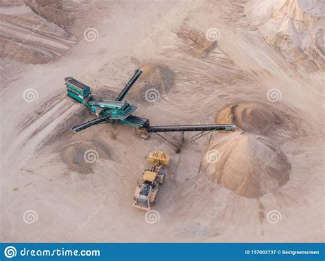 Aerial View Of A Quarry With Conveyor Belt And Wheel Loader Stones