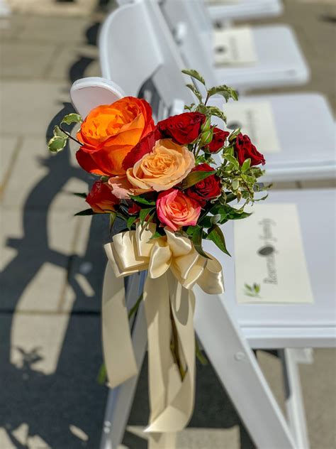 With endless possibilities and inspiration available, chair decor is a great alternative to chair covers (which can prove to work out quite costly). Orange roses, with peach and burgundy spray roses ...