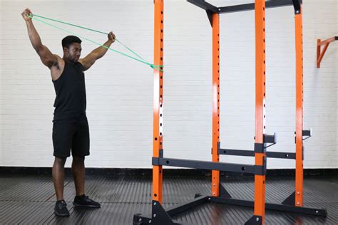 Hold the resistance band next to your shoulders in a secure and locked position. Top 8 Resistance Band Shoulder Exercises | Mirafit
