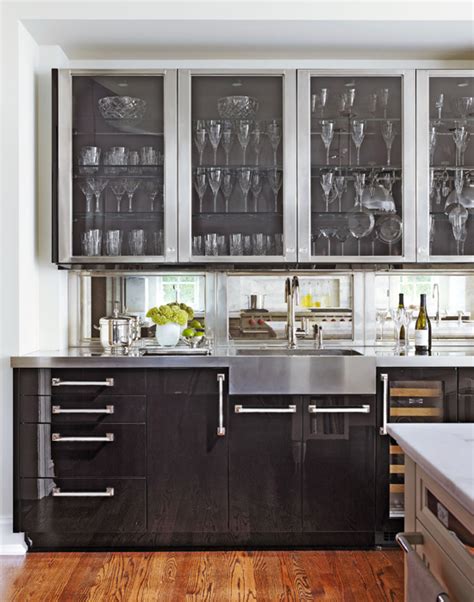 It helps to break up the monotony of rows of flat front cabinets, lance thomas, designer and half of the duo. Distinctive Kitchen Cabinets with Glass-Front Doors ...