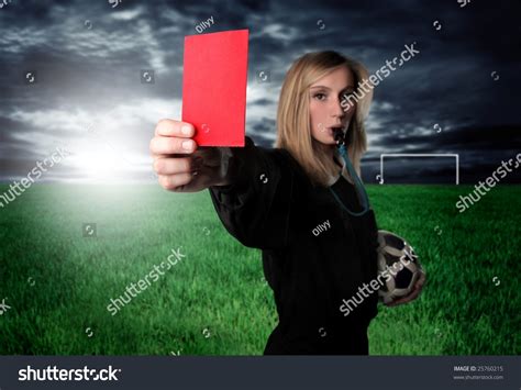 Portrait Of A Female Soccer Referee Showing A Red Card Focus On Card