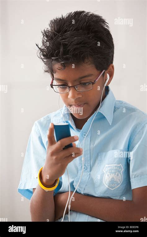 Teenage Boy Listening To A Ipod Stock Photo Alamy
