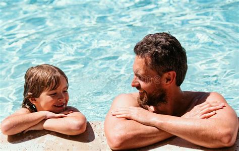 Father And Son Relax In Swimming Pool Pool Resort Summer Weekend