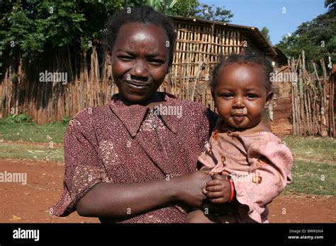 Young Ethiopian Girl Holds Smiling Baby Sister Stock Photo Alamy