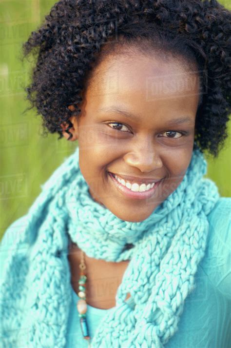 Close Up Of Babe African Woman Smiling Outdoors Stock Photo Dissolve