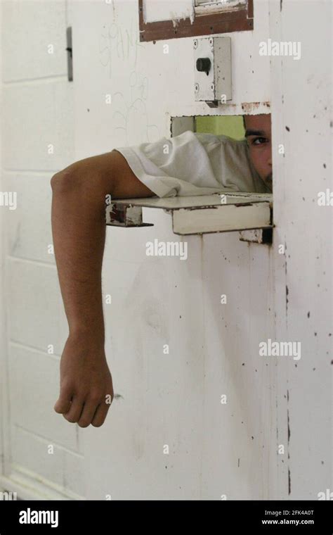 Stockton United States Jul 05 2005 Prisoner Peeking Out Of Cell Door Tray Slot On A Maximum