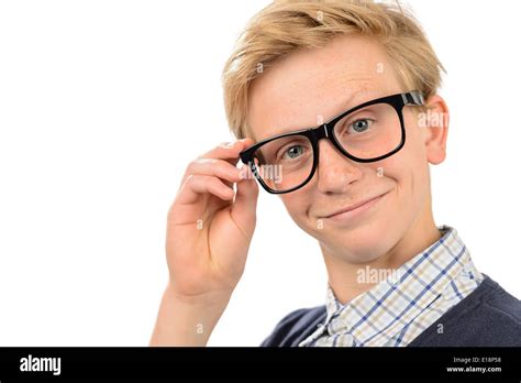 Confident Teenage Nerd Boy Holding Geek Glasses Against White