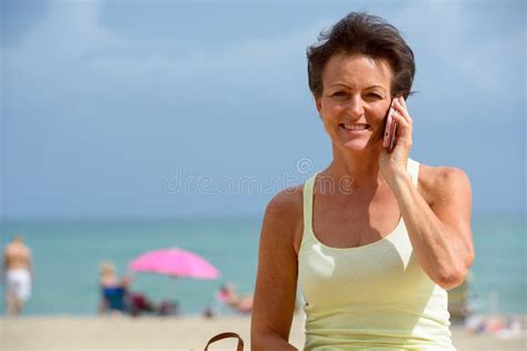 Mature Beautiful Tourist Woman At The Beach Outdoors Stock Photo