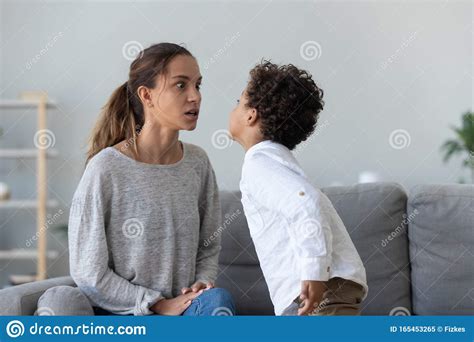 Provocative Mixed Race Little Kid Demonstrating Impolite Behavior To