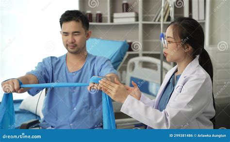 Nurse Helping Physical Therapy of Male Patient at Hospital, Asian