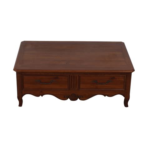 The table has slightly tapered legs and one narrow center drawer with a cherry wooden knob. 88% OFF - Ethan Allen Ethan Allen Storage Coffee Table ...