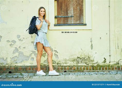 A Woman Standing In Front Of A Building Stock Image Image Of Girl Fashionable