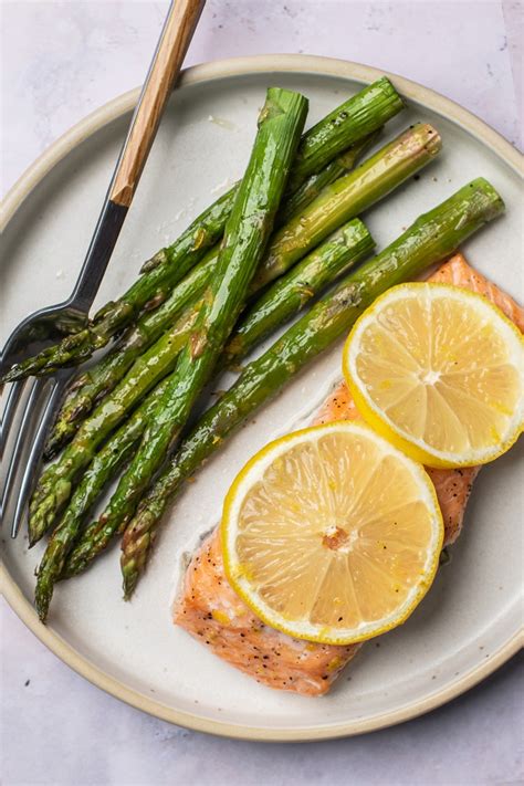 Roast in the preheated oven until the asparagus is tender, about 15 minutes. Simple One Pan Lemon Salmon with Roasted Asparagus