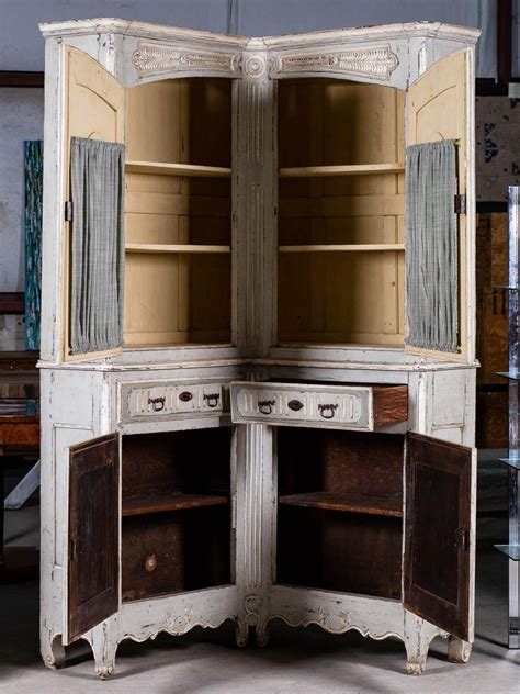 Antique green painted corner cabinet with flowers in panels. Antique French Louis XV Period Painted and Carved Corner ...
