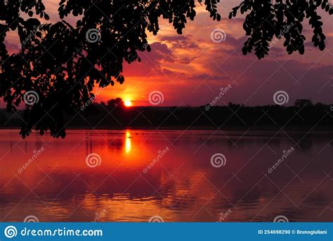 Dramatic Sky At Sunset Over The Water Stock Photo Image Of Scene