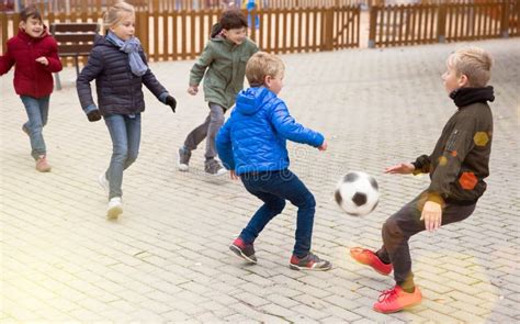 Kids Playing Football Outdoors Stock Photo Image Of Football Sport