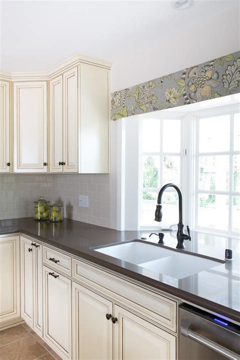 This design will make a perfect look for your kitchen. Cottage Kitchen With Bay Windows and Custom Glazed ...