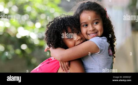Brazilian Girl Kissing Sister In The Cheek Real People Love And Care Stock Video Footage Alamy