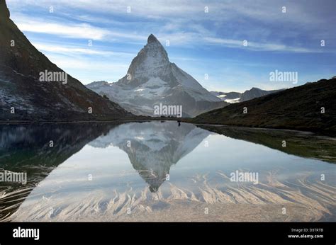The Matterhorn Mountain Reflects In The Riffelsee Lake Above Zermatt