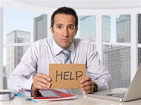 Desperate Senior Businessman In Crisis Asking For Help At Office In