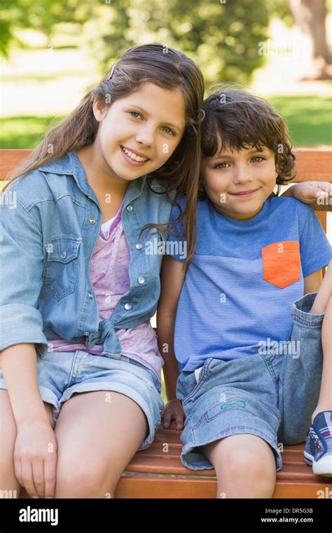 Girl Boy Sitting On Bench Hi Res Stock Photography And Images Alamy
