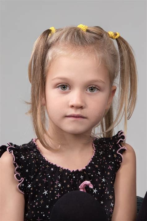 Adorable Sad Little Girl Looking At The Camera Stock Photo Image Of