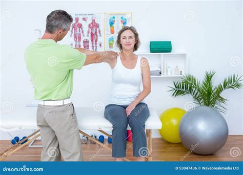 Doctor Stretching His Patients Arm Stock Photo Image Of Painful