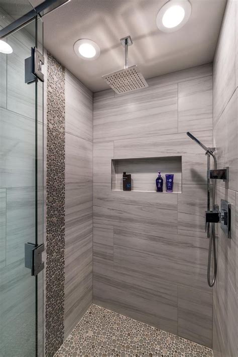 Round Tiles Give A Pebbled Look And Feel To This Stylish Walk In Shower