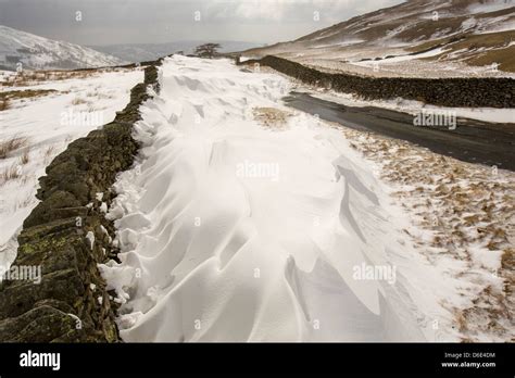 Massive Snow Drifts Block The Kirkstone Pass Road Above Ambleside In