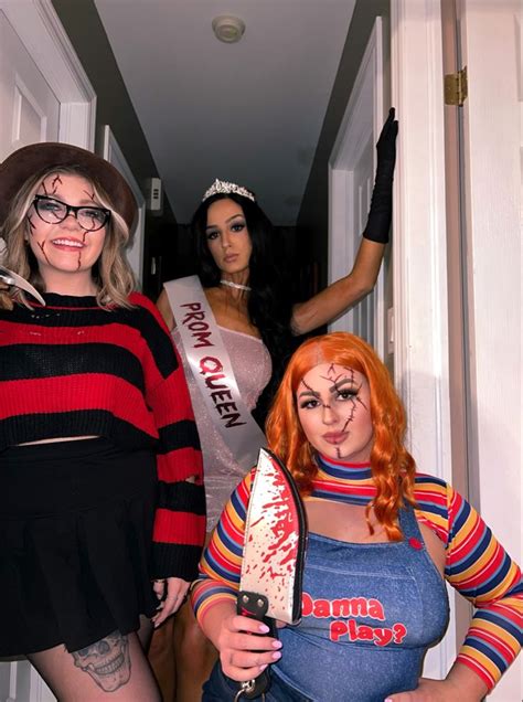 Three Women Dressed Up In Costumes Standing Next To Each Other