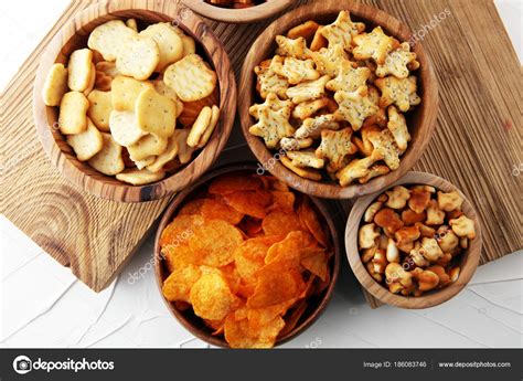 Salty Snacks Pretzels Chips Crackers In Wooden Bowls Stock Photo By