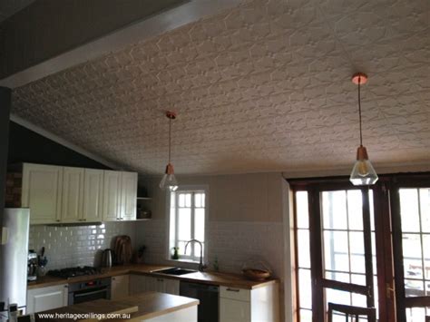 Vine motifs, curves, beading, and other intricate visuals embossed on real metal panels or embossed on tin look mineral fiber tiles become a textured focal point in a room. Pressed Tin Ceiling - Kitchen Renovation