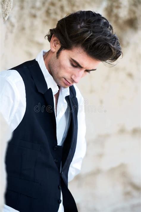 Tall Dark And Brooding Closeup Of A Handsome Young Male Wearing A