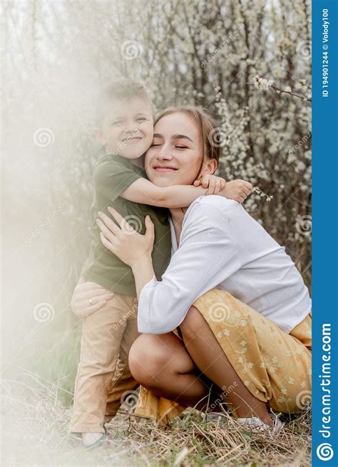 Happy Mother And Son Having Fun Together Mother Gently Hugs Her Son