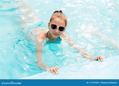 Beautiful Girl In A Swimsuit Swims In The Pool Stock Image Image Of