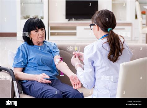 Doctor Making Injection To Senior Old Woman Stock Photo Alamy