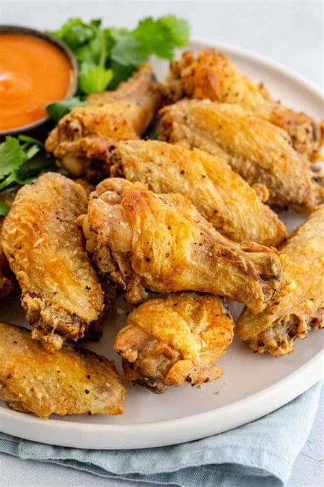 Cornstarch is a a thickener when combined with water (starches swell up and gelatinize in the presence of water), and will help keep a coating from washing away. Baked Chicken Wings - Jessica Gavin