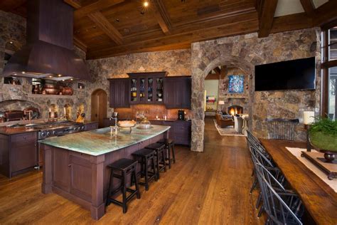 Rustic Kitchen With Two Islands Stone Walls Hgtv