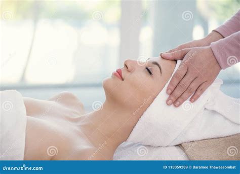 Masseur Doing Massage The Head Of Beautiful Young Woman Relaxing Stock Image Image Of Masseur