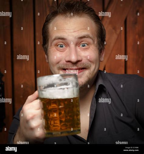 Happy Man Drinking Beer From The Mug Stock Photo Alamy